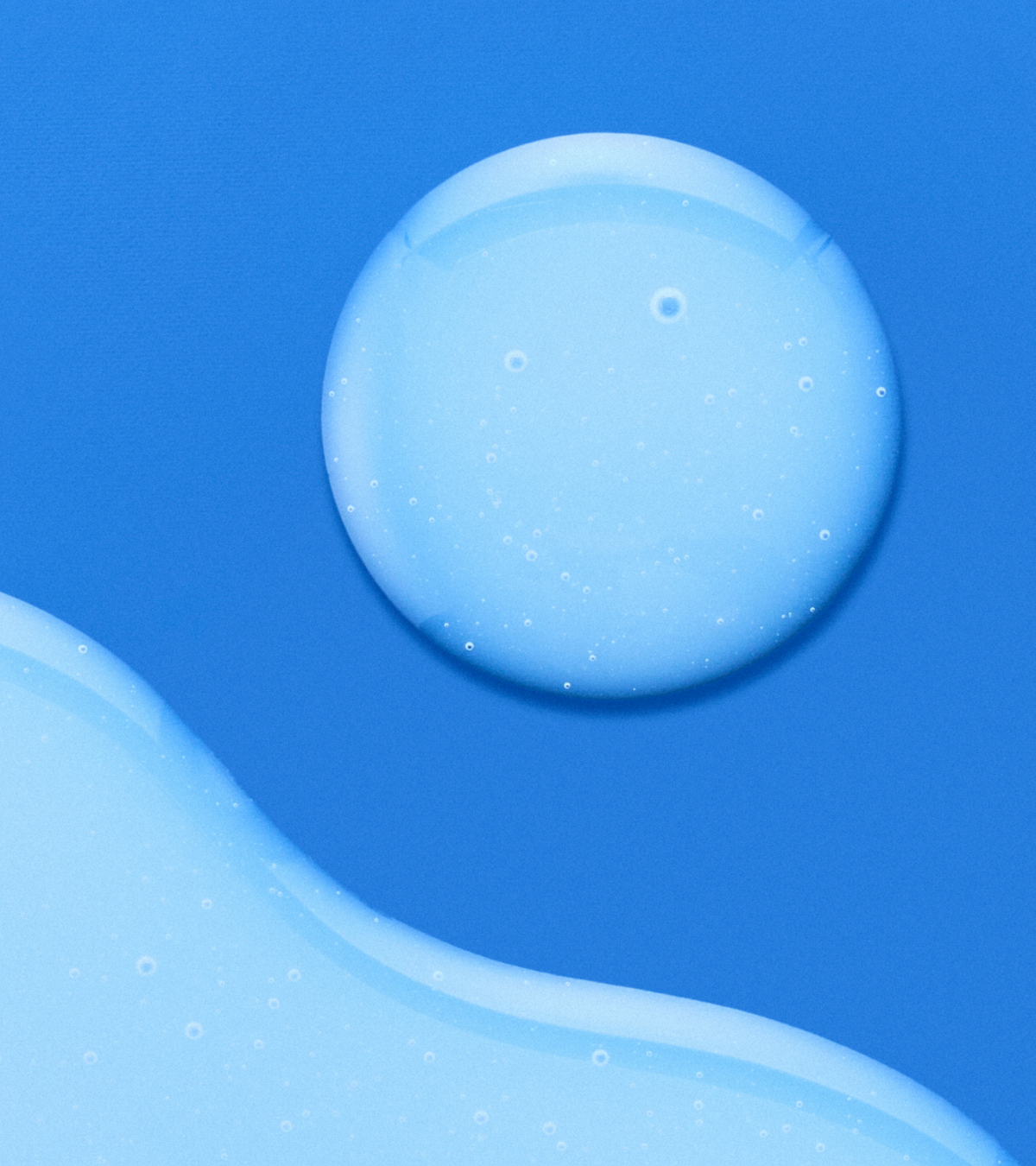 dieux Dieux-deliverance-3-in-1-repair-serum-droplet-and-pool-blue-background.