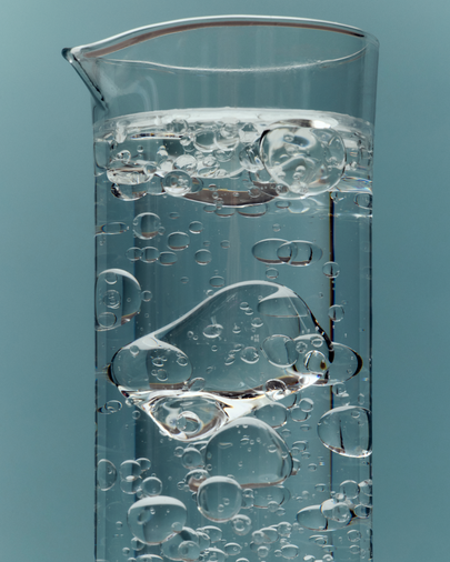 Clear gel with bubbles in a glass beaker